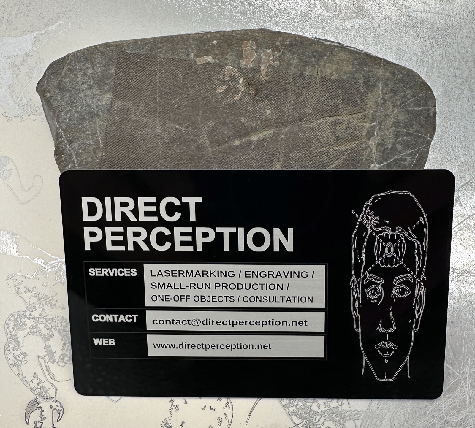 Direct Perception engraved metal business card, contact side.